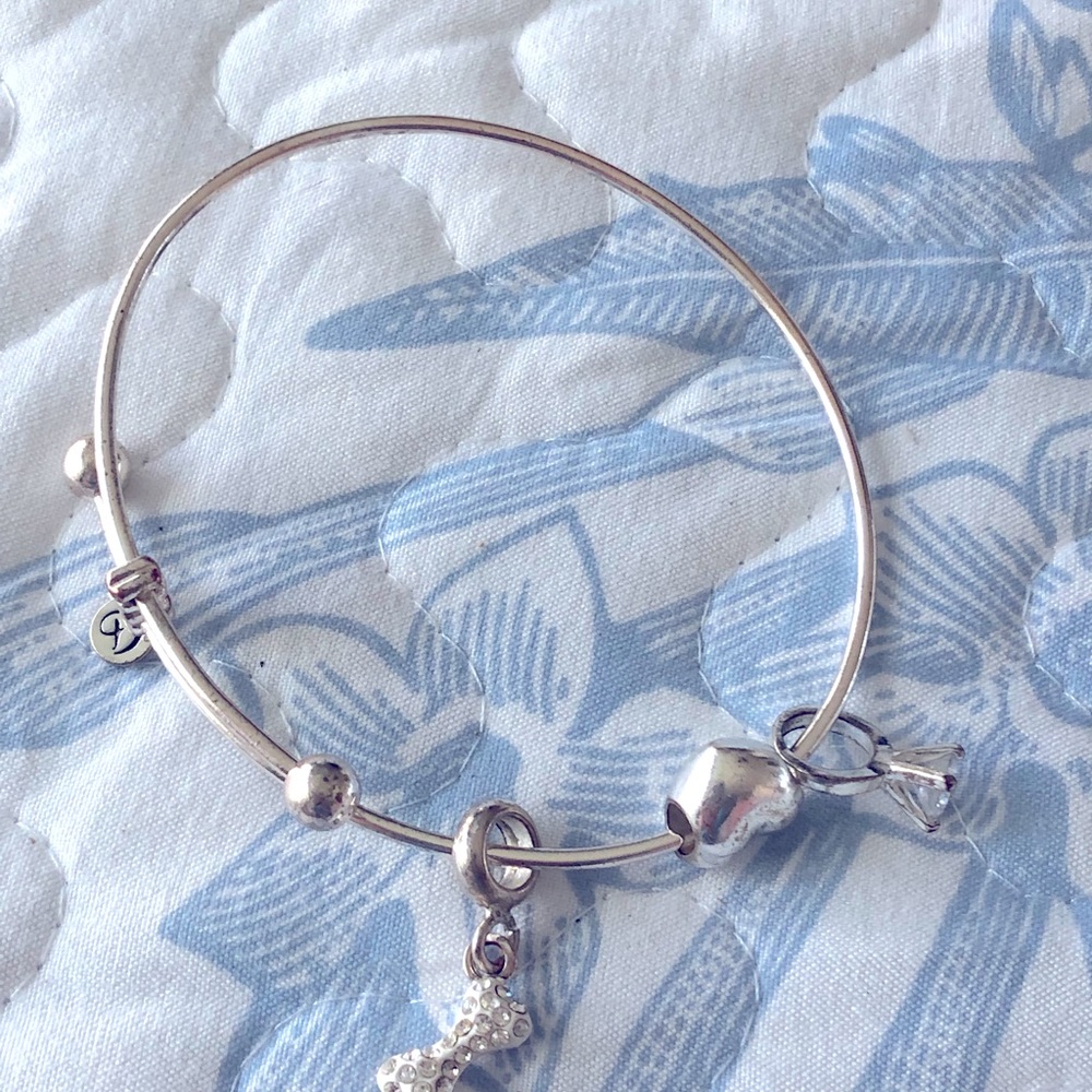 Charms Bracelet Expandable with 3 charms Maker’s marks. No metal content stamps.